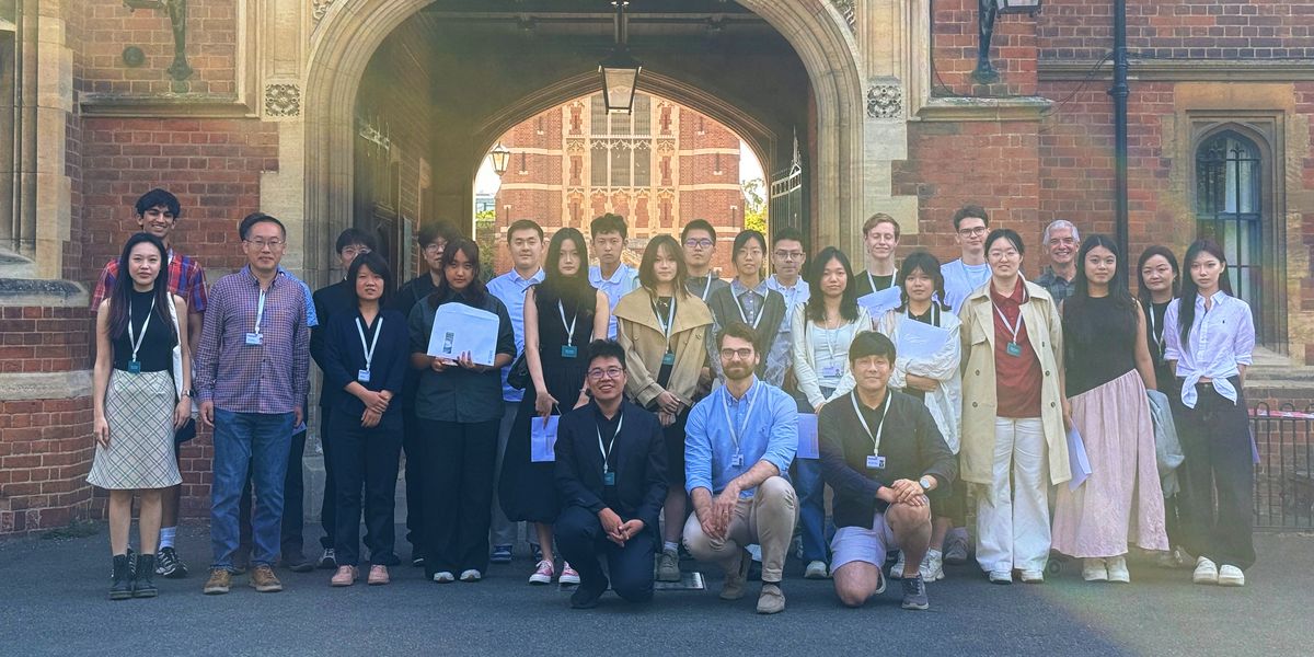 The 2026 summer school group at the gatehouse of Selwyn College
