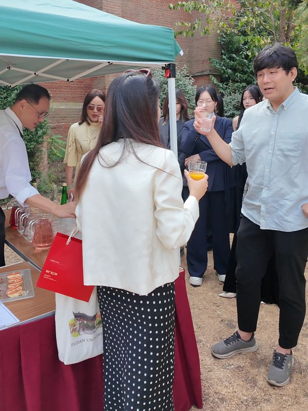 Students and teachers at the garden party at Selwyn College