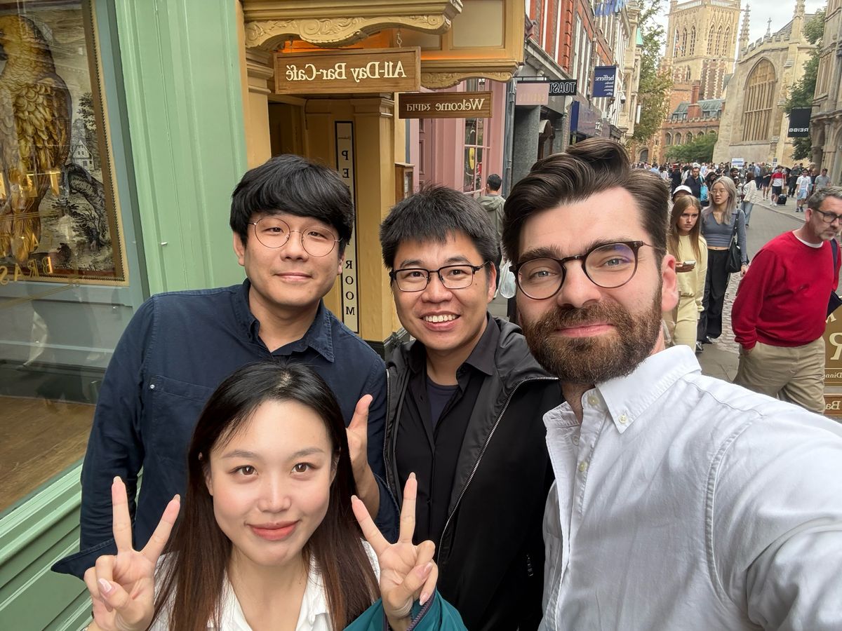 Teachers and a student taking a selfie in the city centre